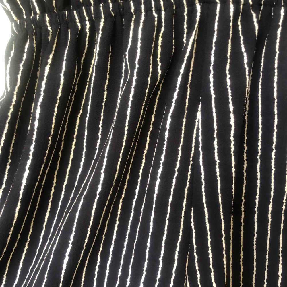 Low cut black and white romper. Brand In the Beginning. Size S.